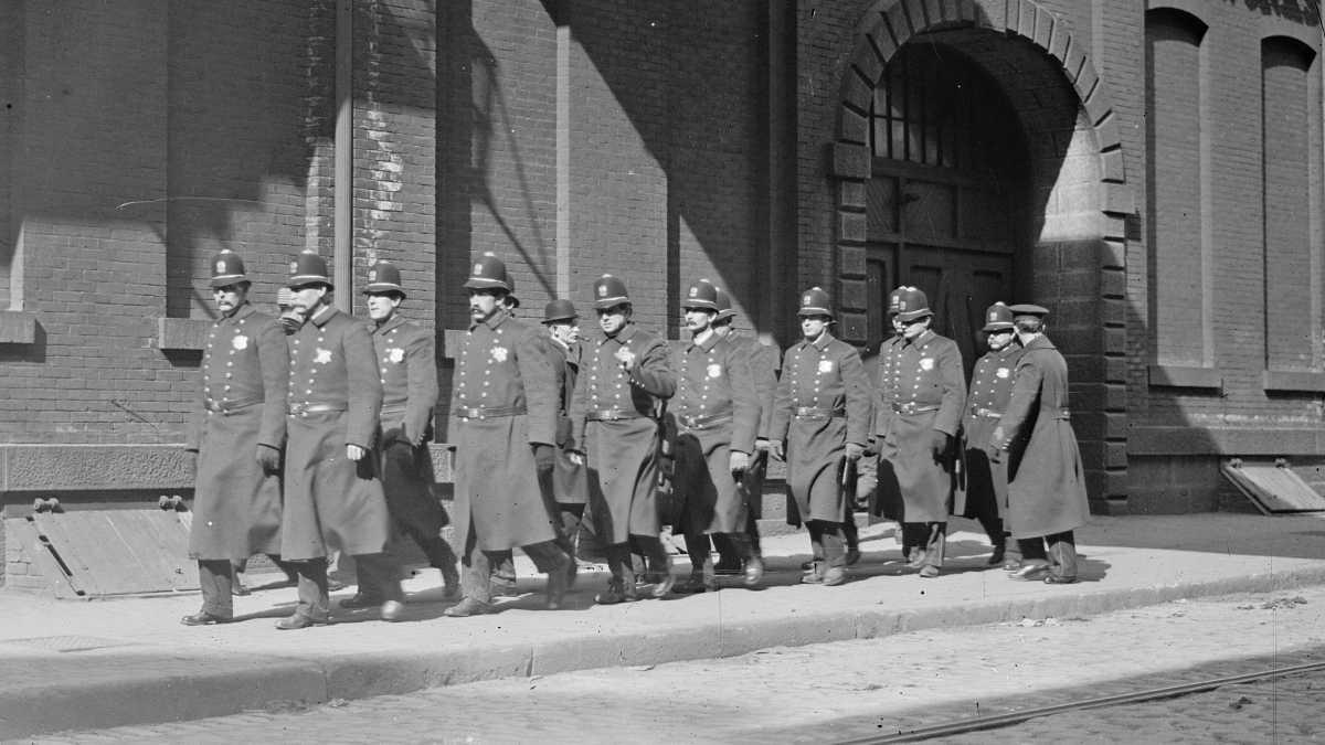 In the photograph, police patrol marching outside Baldwin Locomotive Works in Philadelphia, Pa. circa 1910.