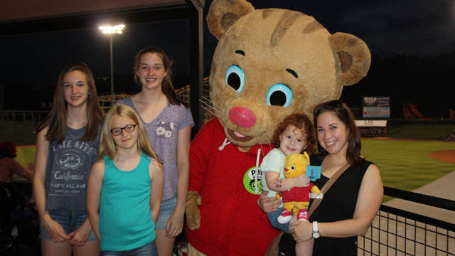 Fans pose for a picture with Daniel Tiger