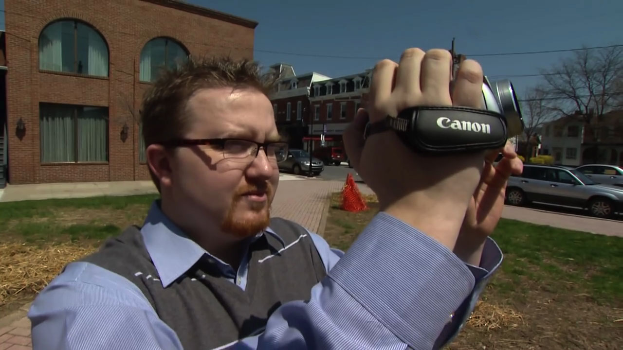 man holding a video camera