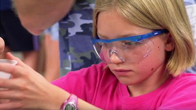 young girl wearing safety glasses
