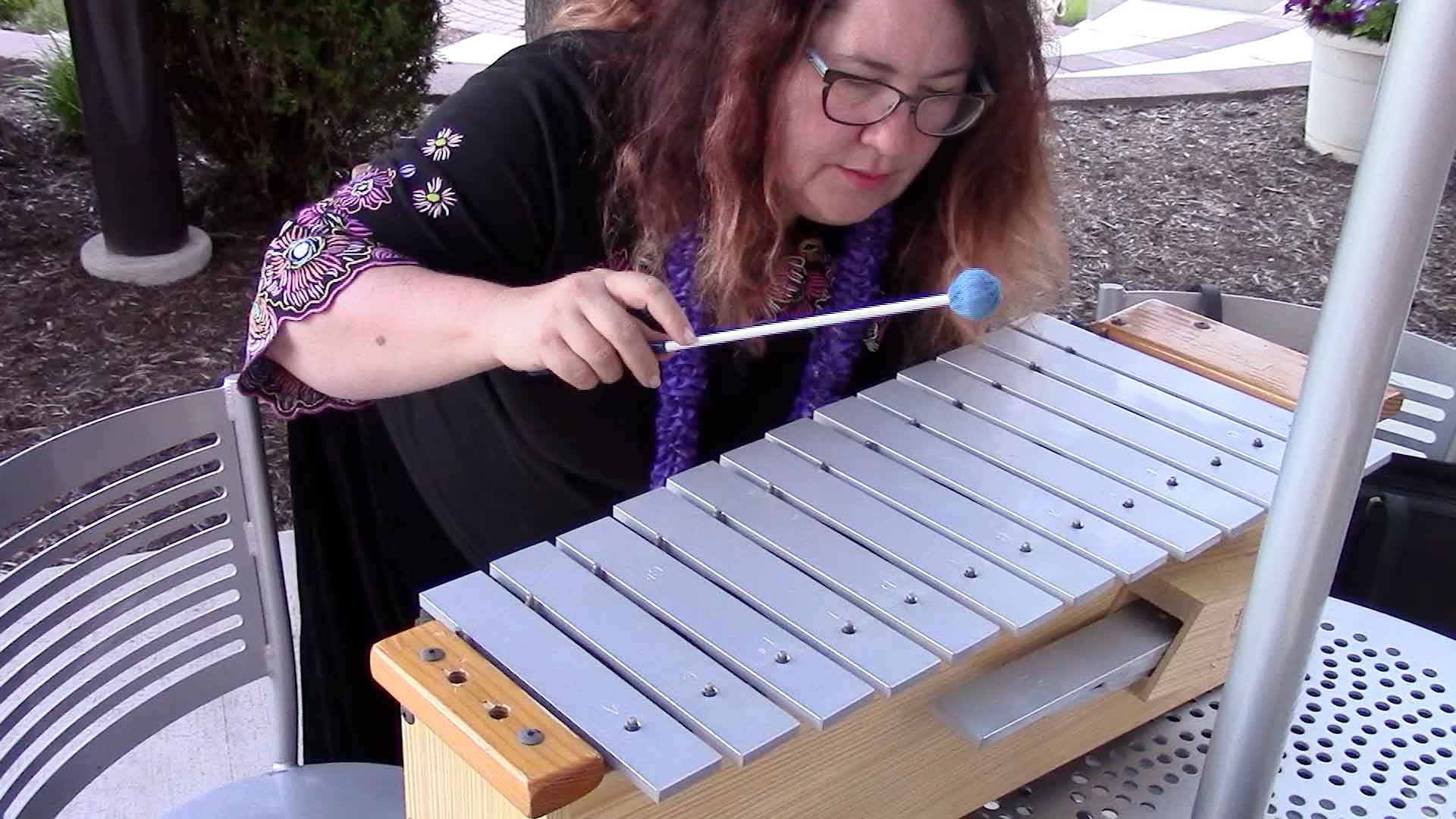 Melanie plays the xylophone