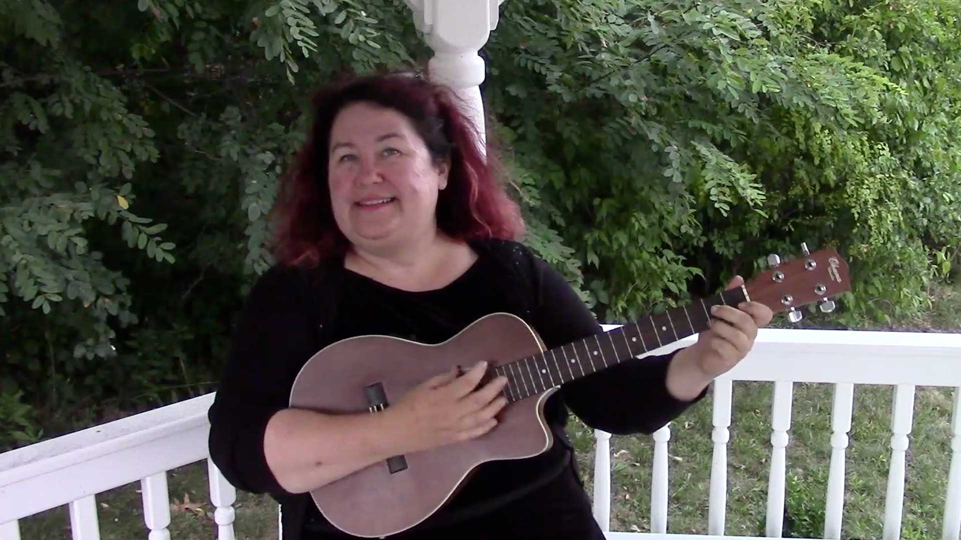 Melanie plays her ukulele