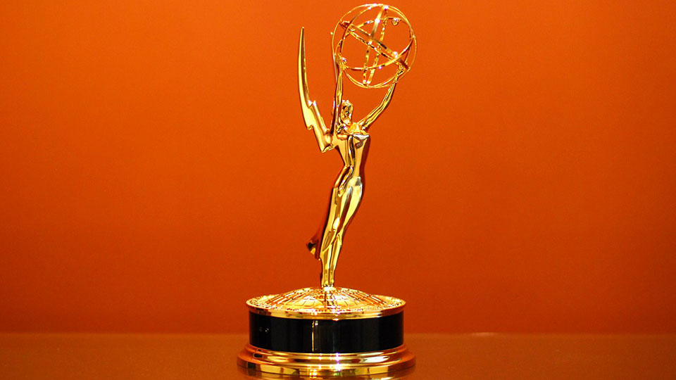Emmy Award against orange background