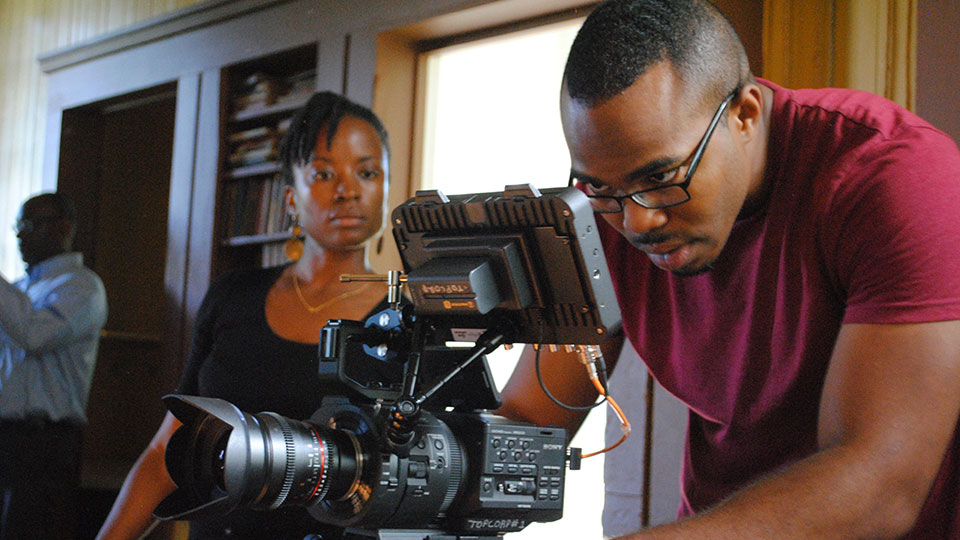 WPSU producer and videographer working behind video camera