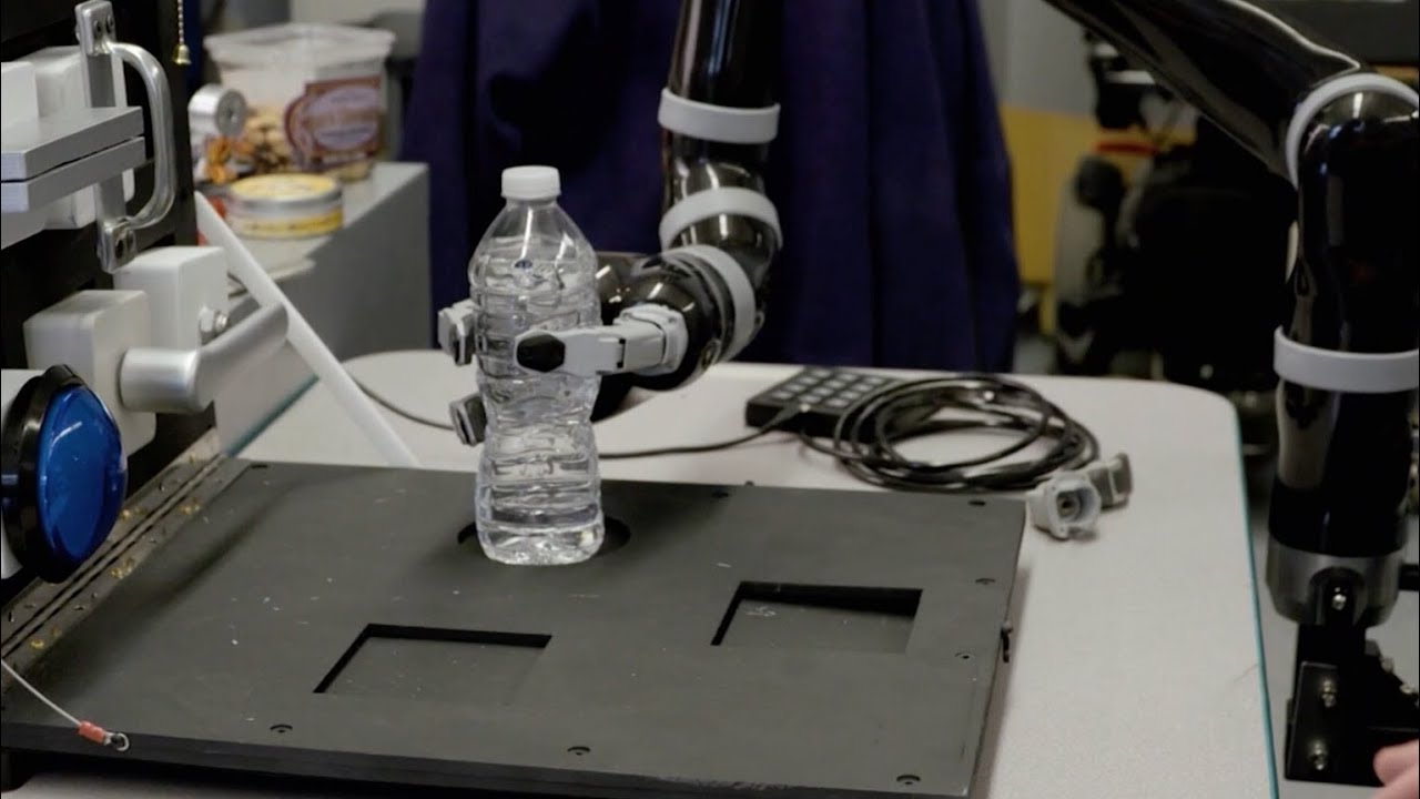 Robotic arm holding bottle of water