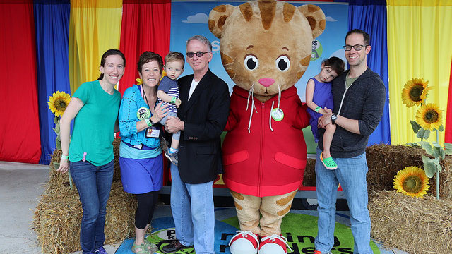 Danile Tiger character poses for photos with family