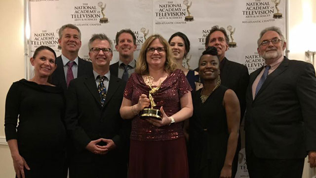 WPSU staff members posing for photo with Mid-Atlantic Emmy Award for Station Excellence