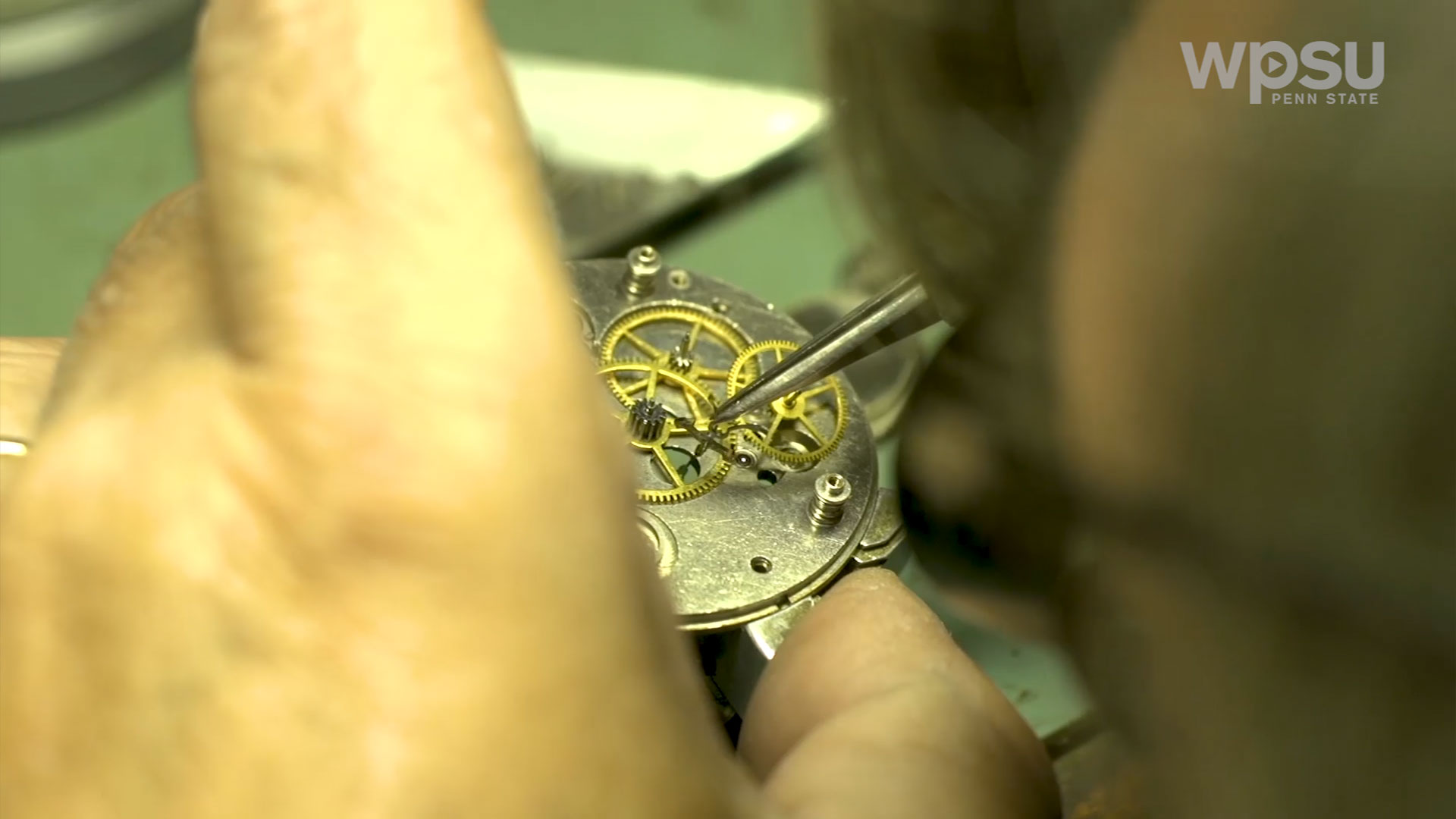 close up of gears of pocket watch