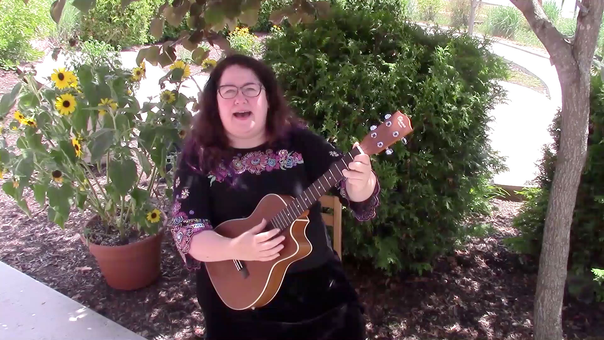 Melanie plays her ukulele