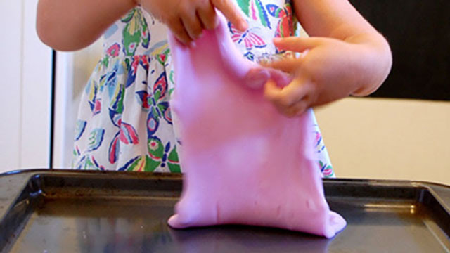 child playing with slime