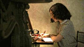 actress portraying Anne Frank writing in diary