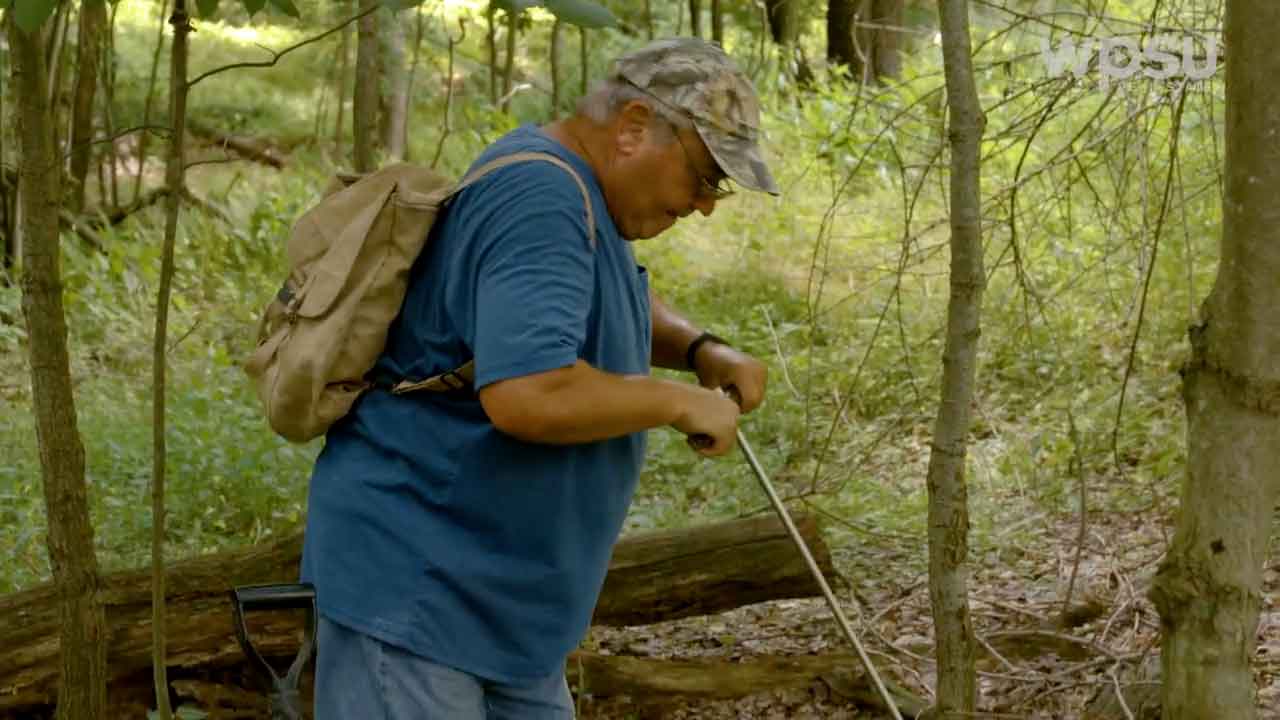 Person digging in the ground