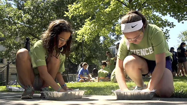 two girls making hand casts