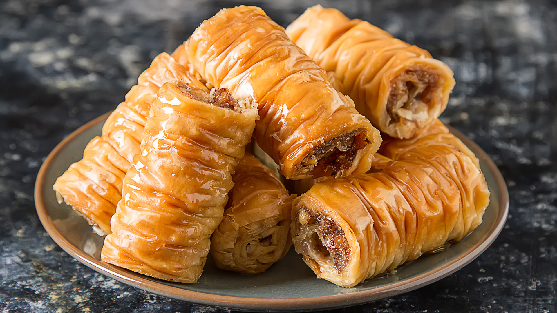 Traditional eastern arabic dessert Baklava with Turkish honey and walnuts, selective focus.