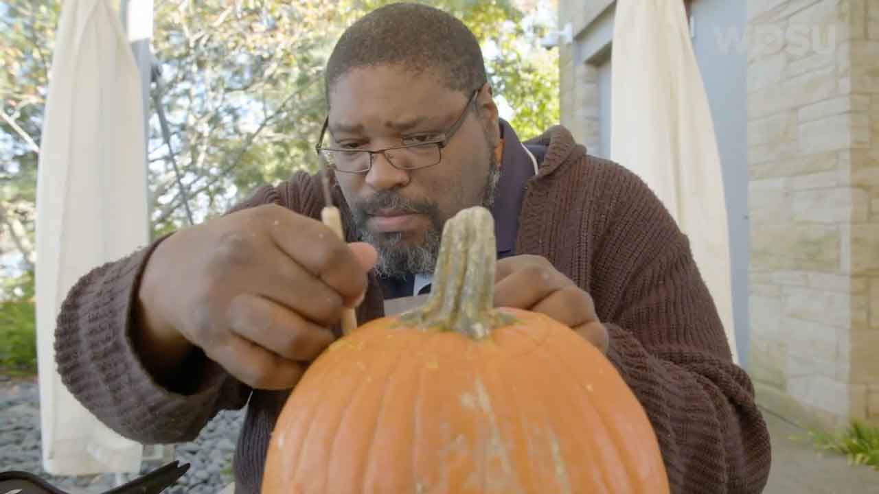 Terry carving a pumpkin