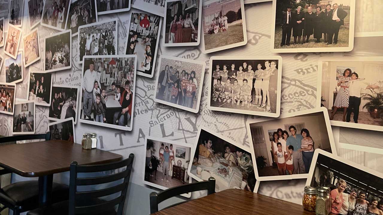 Collage of photos on the wall of restaurant.