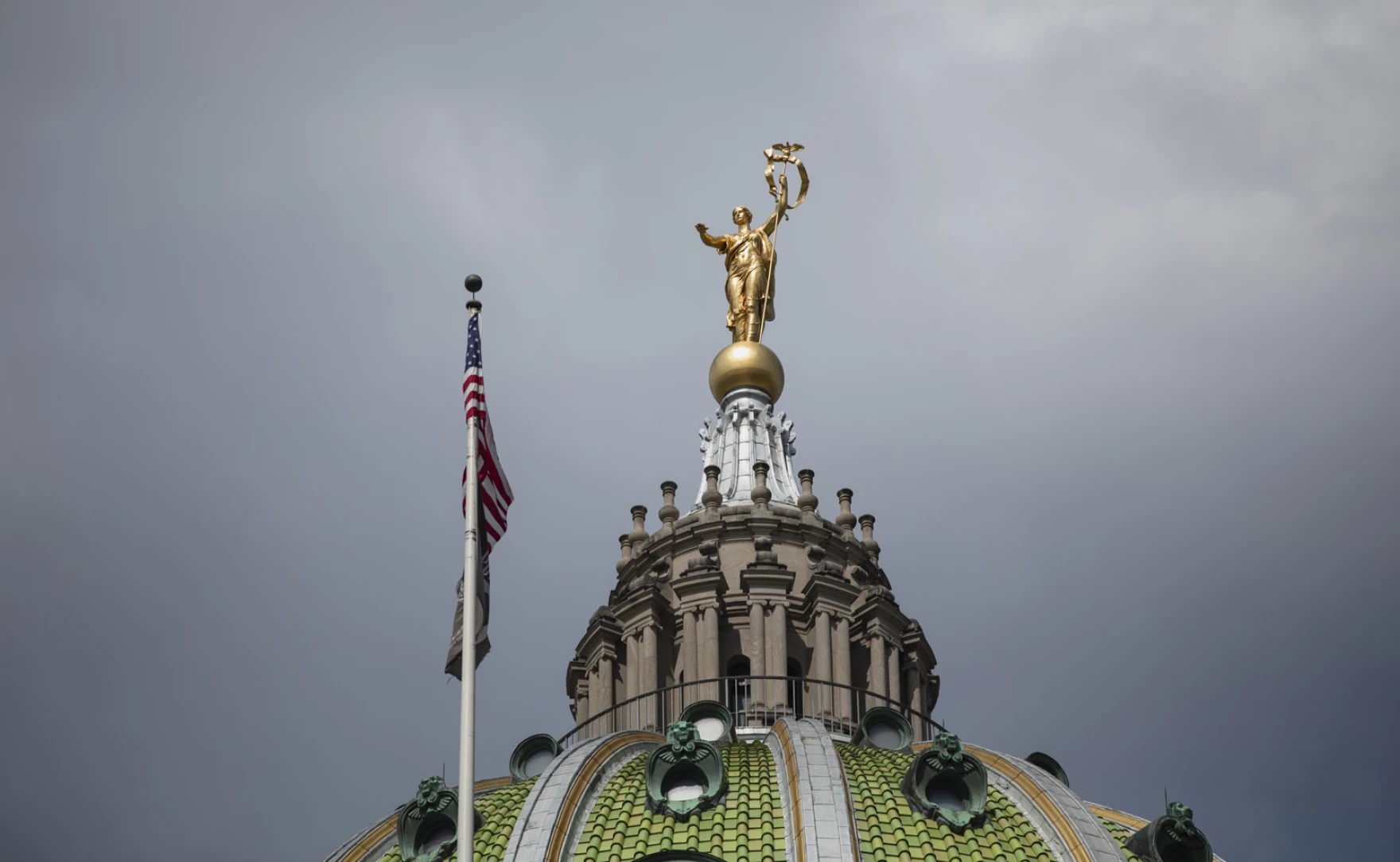 Close up of the gold statue atop the state capitol building in Harrisburg PA.