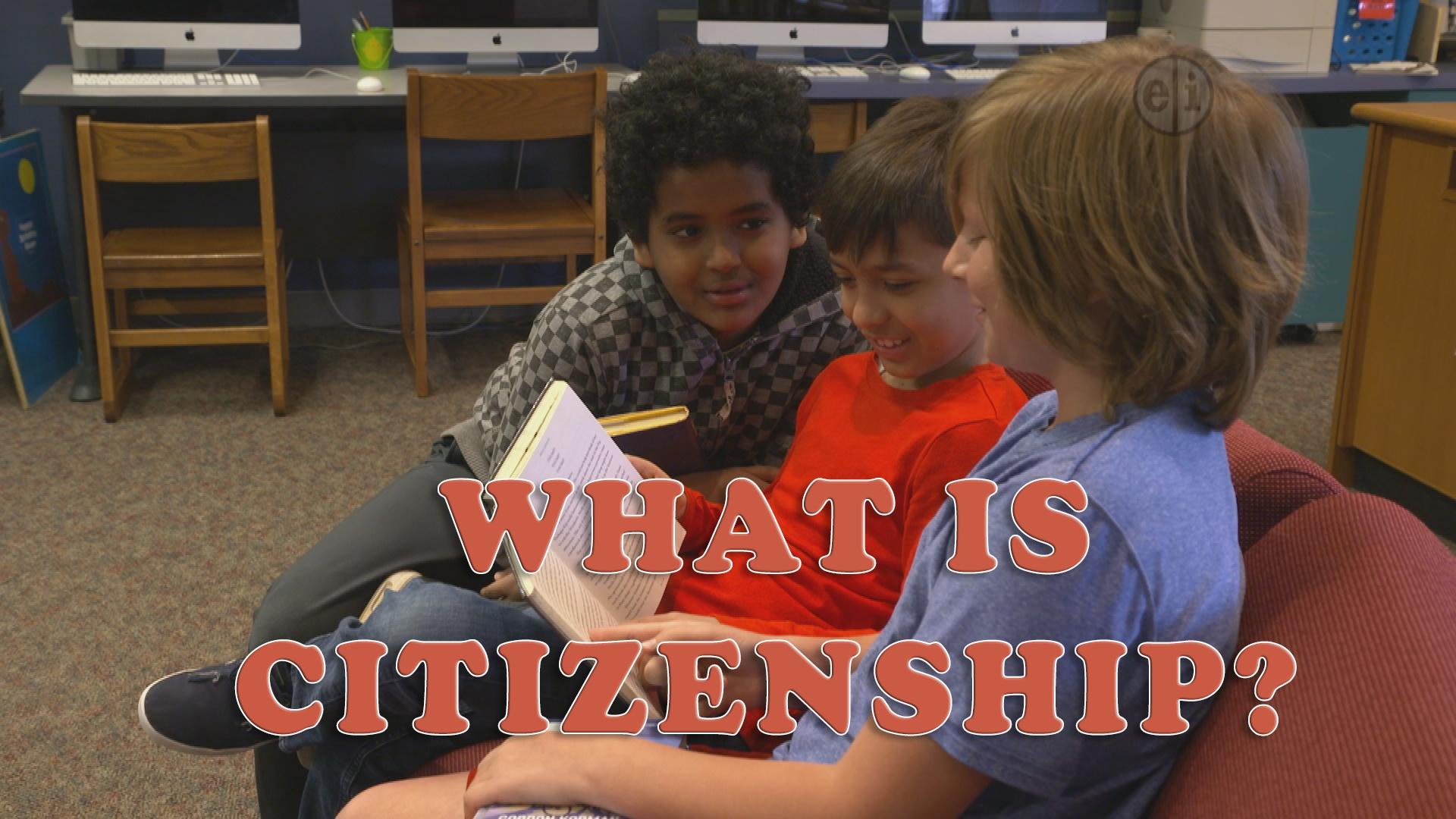Three grade school kids of various race looking at a book accompanied by text that reads 'What Is Citizenship?'.