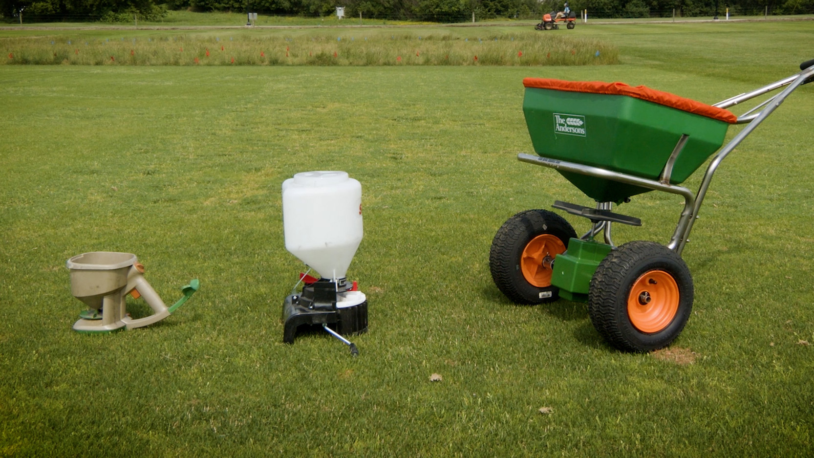 Lawn fertilizing equipment on a green lawn.