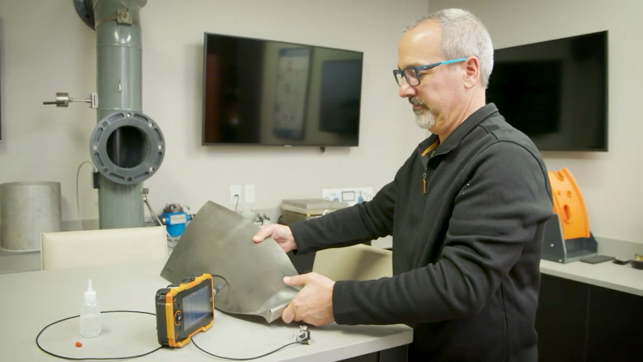 Man operating small equipment.