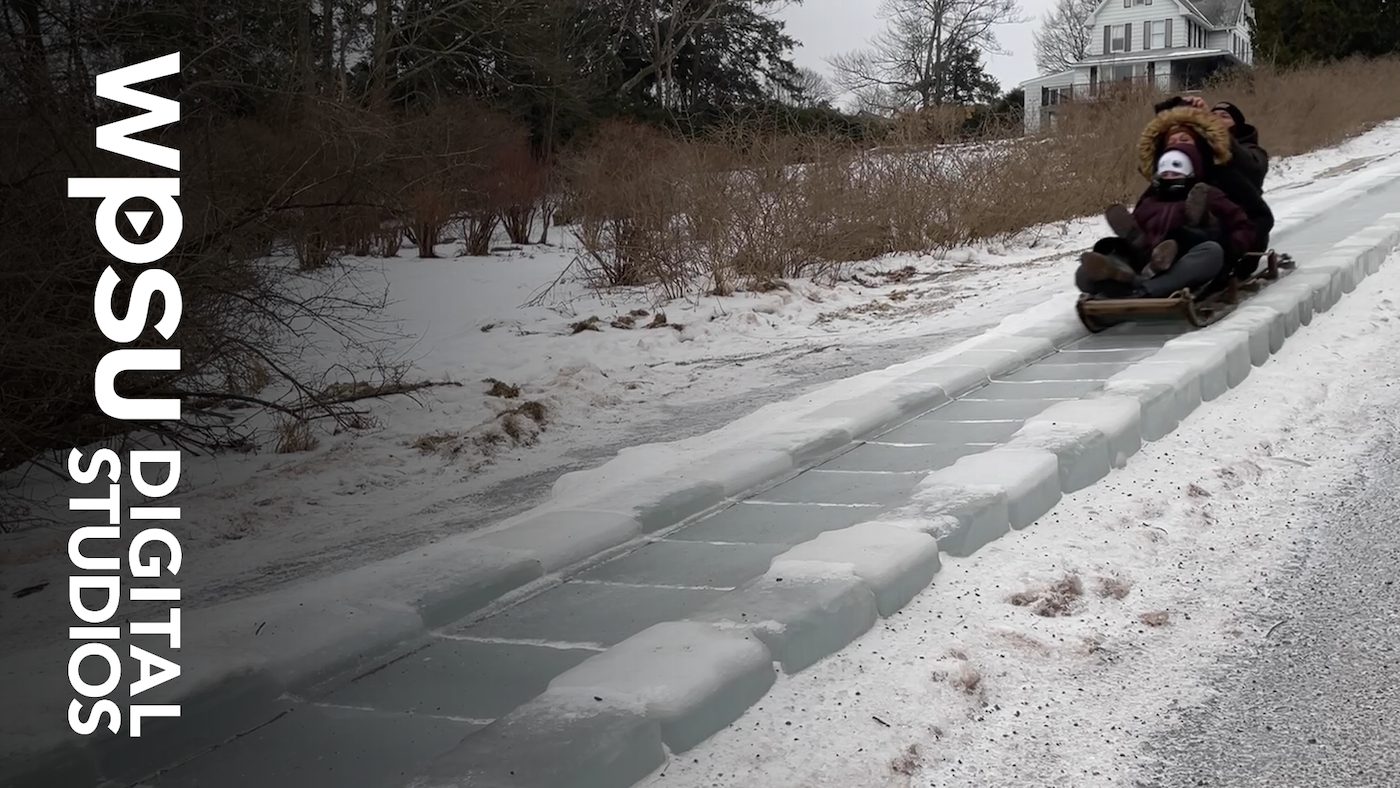 A sled riding down a toboggan slide in Eagles Mere.